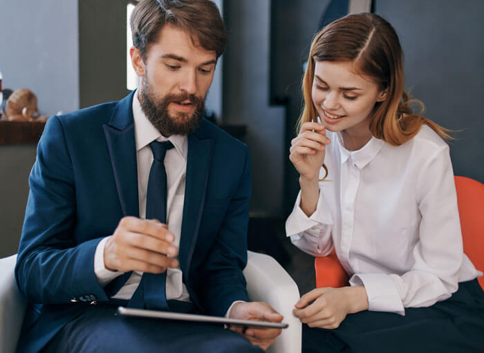 colleagues-communicate-with-tablet-technology-office colleagues-communicate-with-tablet-technology-office